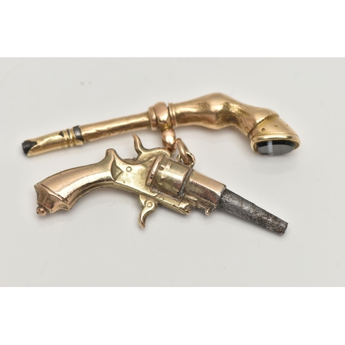 35 - TWO YELLOW METAL NOVELTY WATCH KEYS, the first in the form of a pistol, fitted with a jump ring unma... 