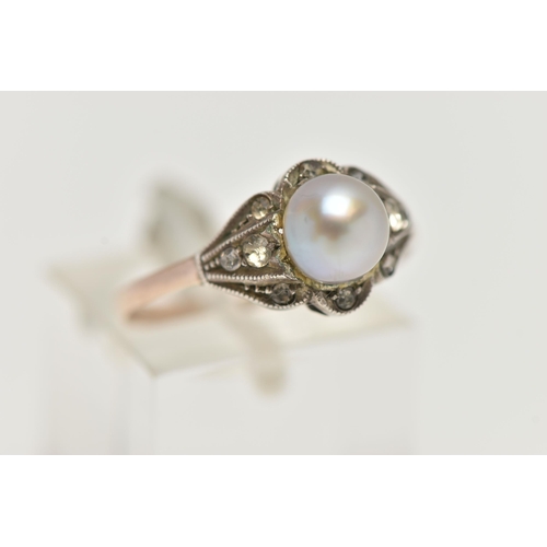 37 - A CULTURED BAROQUE PEARL RING, pearl measuring approximately 6.5mm, in a surround of colourless spin... 