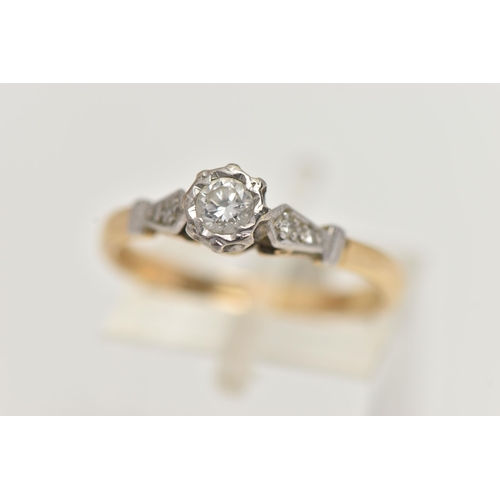 40 - A YELLOW AND WHITE METAL, SINGLE STONE DIAMOND RING, designed with an illusion set round brilliant c... 