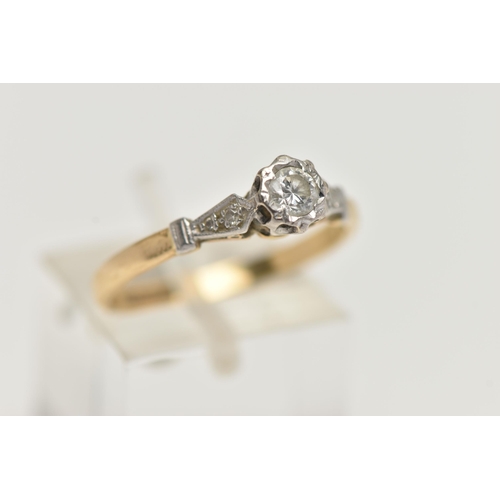 40 - A YELLOW AND WHITE METAL, SINGLE STONE DIAMOND RING, designed with an illusion set round brilliant c... 