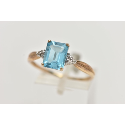 42 - A 9CT GOLD TOPAZ AND DIAMOND RING, designed with a rectangular cut light blue topaz, in a four claw ... 