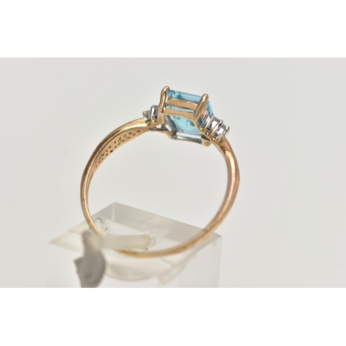 42 - A 9CT GOLD TOPAZ AND DIAMOND RING, designed with a rectangular cut light blue topaz, in a four claw ... 