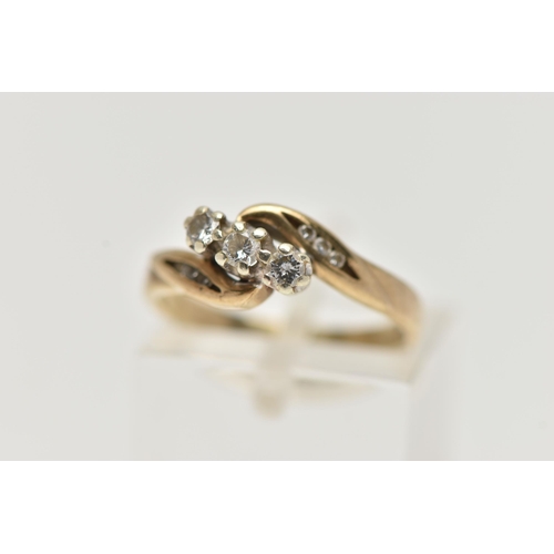 43 - A 9CT GOLD THREE STONE DIAMOND RING, designed with three small round brilliant cut diamonds, each cl... 