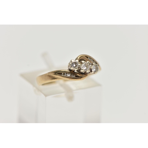 43 - A 9CT GOLD THREE STONE DIAMOND RING, designed with three small round brilliant cut diamonds, each cl... 