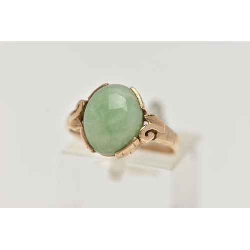 57 - A 9CT GOLD JADE RING, jade cabochon collet set to the scrolling shoulders and polished band, hallmar... 