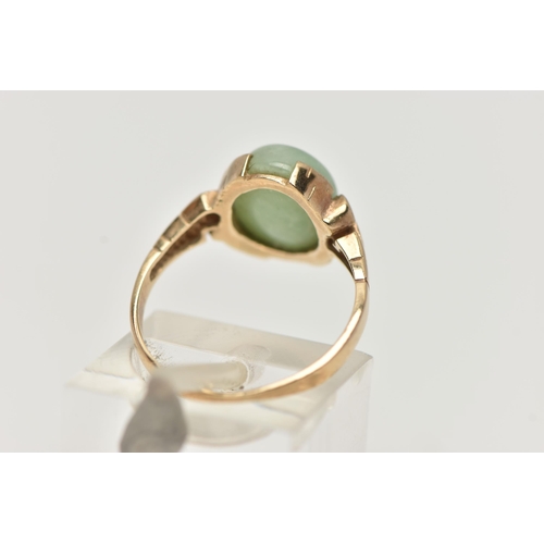 57 - A 9CT GOLD JADE RING, jade cabochon collet set to the scrolling shoulders and polished band, hallmar... 