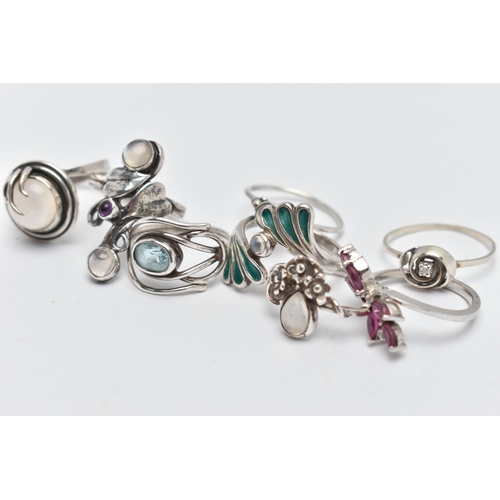 62 - EIGHT WHITE METAL RINGS, various designs some set with semi-precious gemstones such as moonstone, ru... 