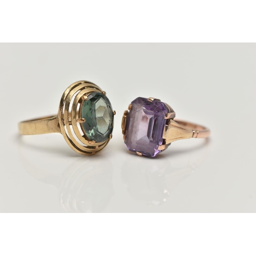 68 - TWO GEM SET RINGS, the first a yellow metal dress ring, set with a green synthetic spinel, stamped 3... 