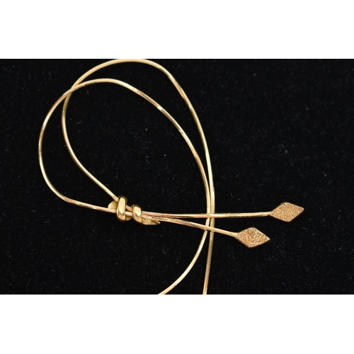 72 - AN 18CT GOLD LARIAT NECKLACE, a yellow gold fine snake chain fitted with textured diamond shape term... 