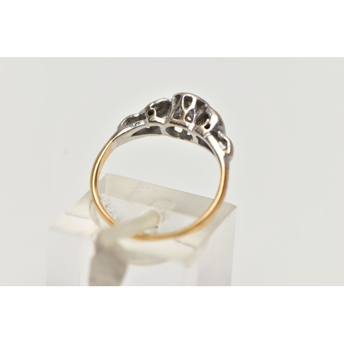 74 - A DIAMOND RING, a single round brilliant cut diamond set within a white metal mount with scrolling d... 