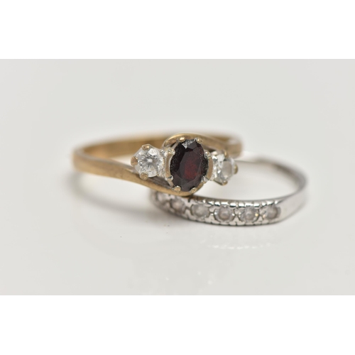 81 - TWO 9CT GOLD GEM SET RINGS, the first an oval cut garnet and two circular cut cubic zirconia, prong ... 