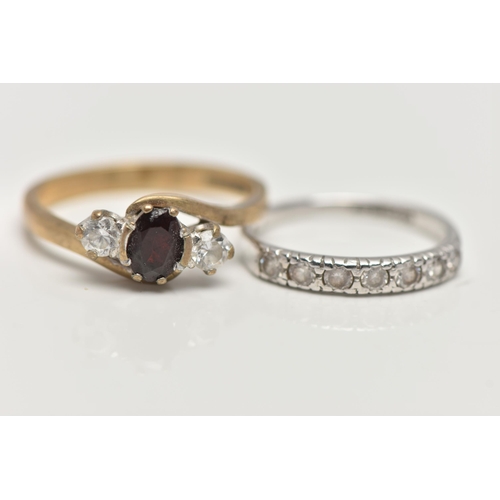 81 - TWO 9CT GOLD GEM SET RINGS, the first an oval cut garnet and two circular cut cubic zirconia, prong ... 