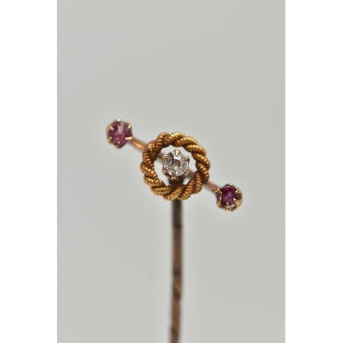 93 - AN EARLY 20TH CENTURY DIAMOND AND GEM STICKPIN, designed as a central old cut diamond within a rope ... 