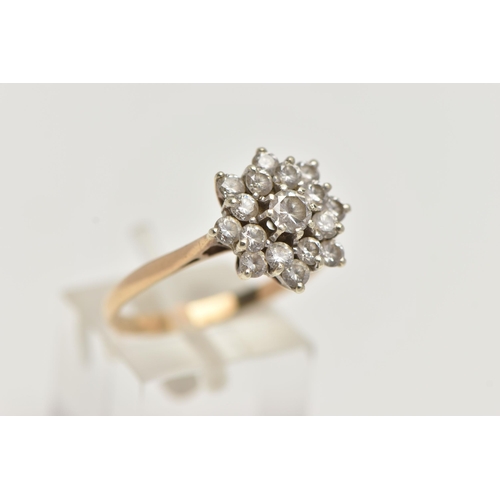 97 - A 9CT GOLD CLUSTER RING, sixteen circular cut cubic zirconia stones, prong set in yellow gold, hallm... 