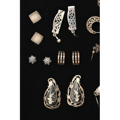 98 - AN ASSORTMENT OF WHITE METAL EARRINGS, twenty four pairs of earrings, to include stud and drop earri... 