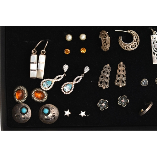 98 - AN ASSORTMENT OF WHITE METAL EARRINGS, twenty four pairs of earrings, to include stud and drop earri... 