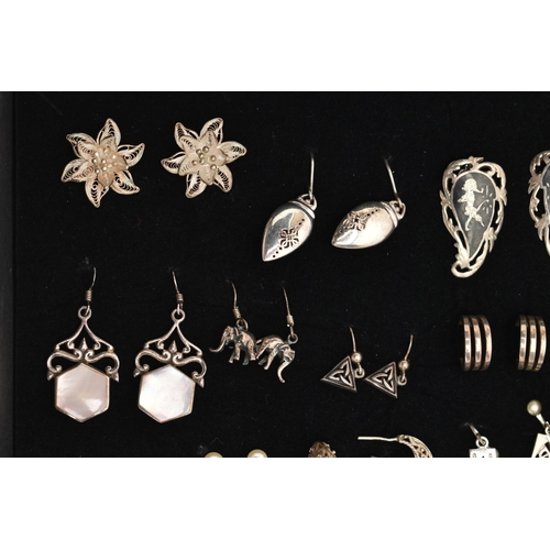 98 - AN ASSORTMENT OF WHITE METAL EARRINGS, twenty four pairs of earrings, to include stud and drop earri... 