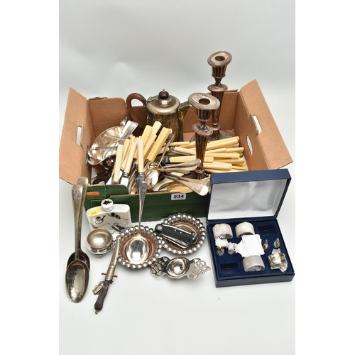 234 - A BOX OF SILVER PLATE AND OTHER METALWARE, including a pair of Old Sheffield Plate fluted oval candl... 