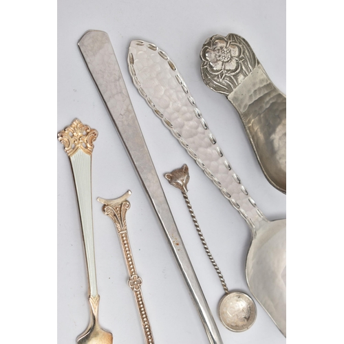 239 - AN ARTS AND CRAFTS PEWTER CADDY SPOON BY JOHN H GREEN AND A FIVE OTHER ITEMS OF FLATWARE, the caddy ... 