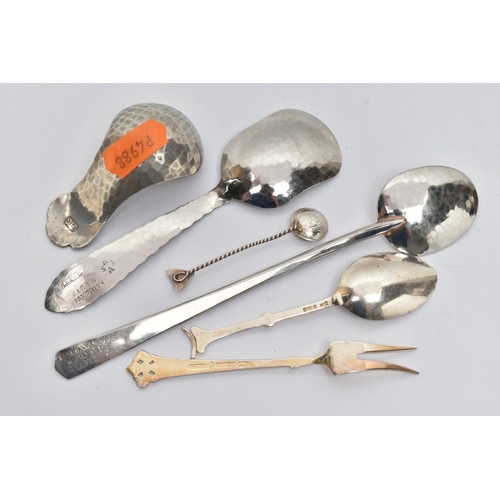 239 - AN ARTS AND CRAFTS PEWTER CADDY SPOON BY JOHN H GREEN AND A FIVE OTHER ITEMS OF FLATWARE, the caddy ... 