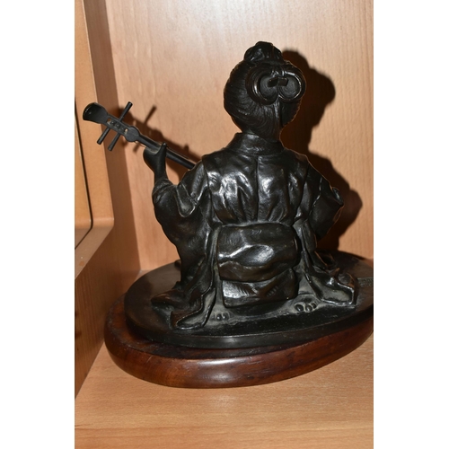 361 - A JAPANESE BRONZE OF A GEISHA KNEELING AND PLAYING A SHAMISEN, cast as singing and with book of musi... 