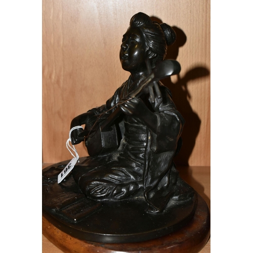 361 - A JAPANESE BRONZE OF A GEISHA KNEELING AND PLAYING A SHAMISEN, cast as singing and with book of musi... 