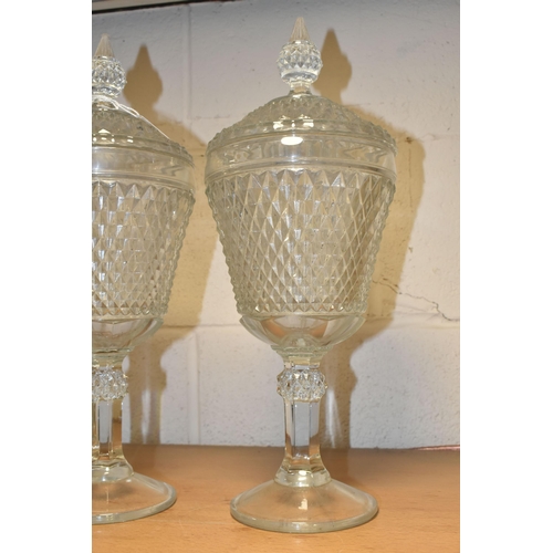 371 - TWO LATE 20TH CENTURY AMERICAN 'INDIANA GLASS' CLEAR PRESSED GLASS JARS AND COVERS OF CHALICE FORM, ... 