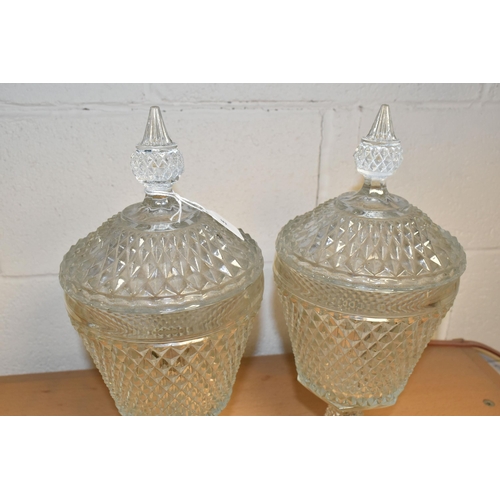 371 - TWO LATE 20TH CENTURY AMERICAN 'INDIANA GLASS' CLEAR PRESSED GLASS JARS AND COVERS OF CHALICE FORM, ... 