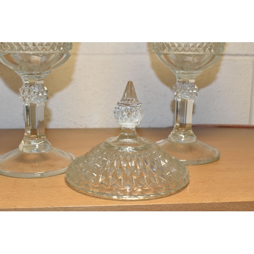 371 - TWO LATE 20TH CENTURY AMERICAN 'INDIANA GLASS' CLEAR PRESSED GLASS JARS AND COVERS OF CHALICE FORM, ... 