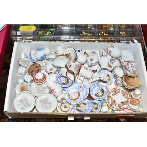 379 - A COLLECTION OF DOLLS HOUSE ITEMS, to include two silver tureens and a tantalus from Simply Silver, ... 