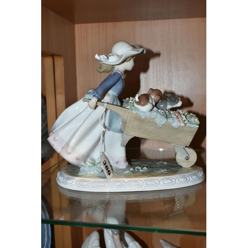 386 - A LLADRO 'A BARROW OF FUN' FIGURE, model no 5460, depicting a girl pushing a wheelbarrow of puppies ... 