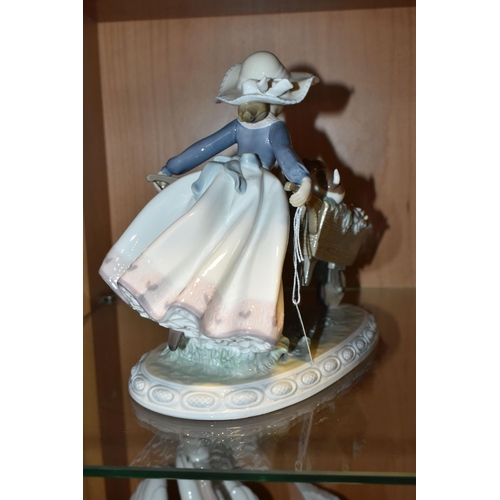 386 - A LLADRO 'A BARROW OF FUN' FIGURE, model no 5460, depicting a girl pushing a wheelbarrow of puppies ... 