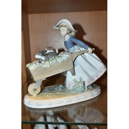 386 - A LLADRO 'A BARROW OF FUN' FIGURE, model no 5460, depicting a girl pushing a wheelbarrow of puppies ... 