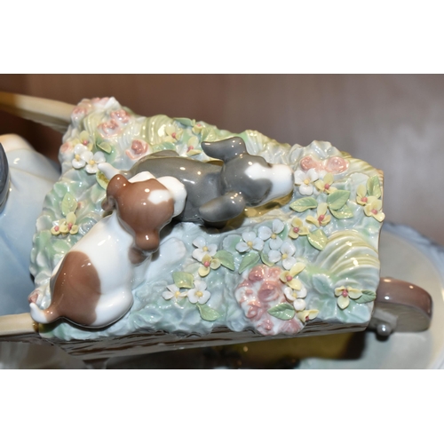 386 - A LLADRO 'A BARROW OF FUN' FIGURE, model no 5460, depicting a girl pushing a wheelbarrow of puppies ... 