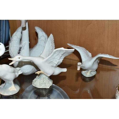 389 - FIVE LLADRO FIGURES, comprising a Swan with wings spread, no 5231, issued 1984-2004, sculptor Fransi... 