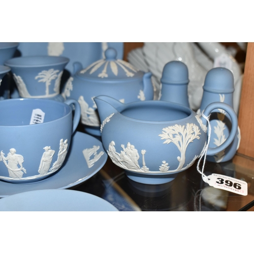 396 - A GROUP OF WEDGWOOD BLUE JASPERWARE, comprising a cup and saucer, cream jug, salt and pepper pots, a... 