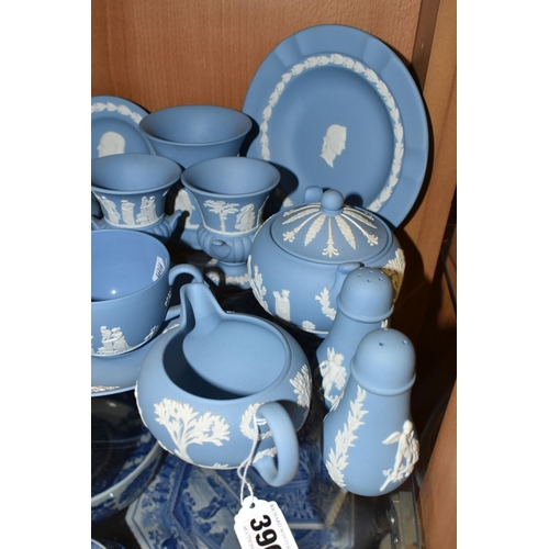 396 - A GROUP OF WEDGWOOD BLUE JASPERWARE, comprising a cup and saucer, cream jug, salt and pepper pots, a... 