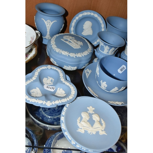 396 - A GROUP OF WEDGWOOD BLUE JASPERWARE, comprising a cup and saucer, cream jug, salt and pepper pots, a... 