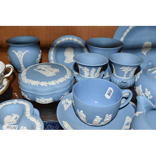 396 - A GROUP OF WEDGWOOD BLUE JASPERWARE, comprising a cup and saucer, cream jug, salt and pepper pots, a... 