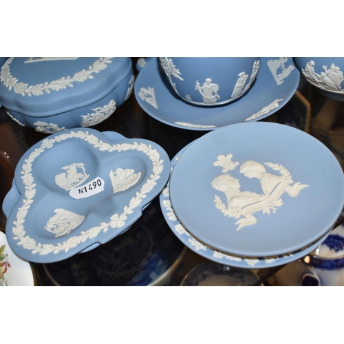 396 - A GROUP OF WEDGWOOD BLUE JASPERWARE, comprising a cup and saucer, cream jug, salt and pepper pots, a... 