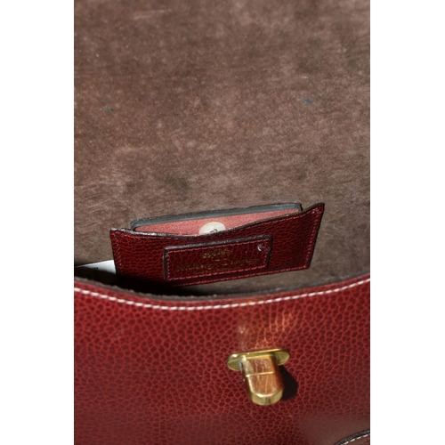 427 - A MULBERRY HANDBAG, of small shoulder/grab bag style, in burgundy leather, serial number 437476, wit... 