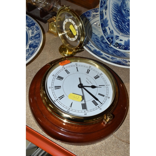 447 - A GROUP OF NAUTICAL CLOCKS AND WALL PLATES, comprising a Kevin Hughes ship's wall cock and barometer... 