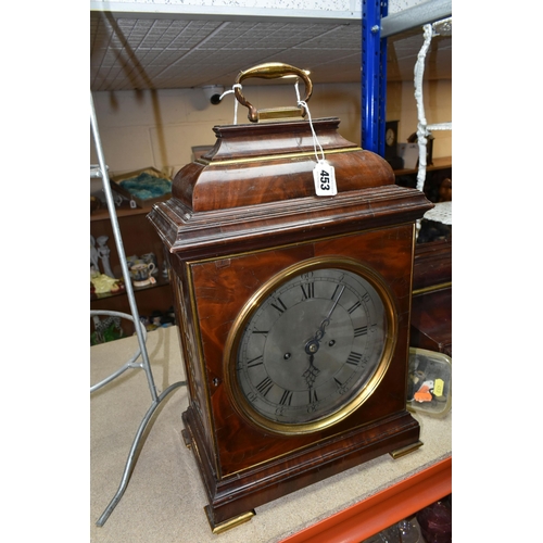 453 - A GEORGE III MAHOGANY AND BRASS MOUNTED BRACKET CLOCK AND BRACKET, the caddy top surmounted by a car... 