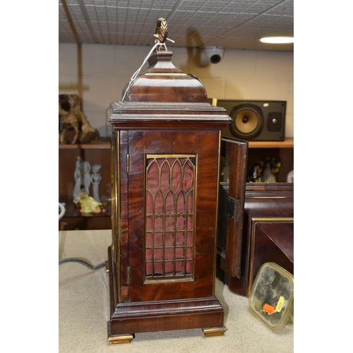 453 - A GEORGE III MAHOGANY AND BRASS MOUNTED BRACKET CLOCK AND BRACKET, the caddy top surmounted by a car... 