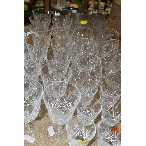 455 - A QUANTITY OF GLASSWARE, to include a set of eight acid etched cranberry wine glasses, three decante... 