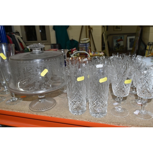 455 - A QUANTITY OF GLASSWARE, to include a set of eight acid etched cranberry wine glasses, three decante... 