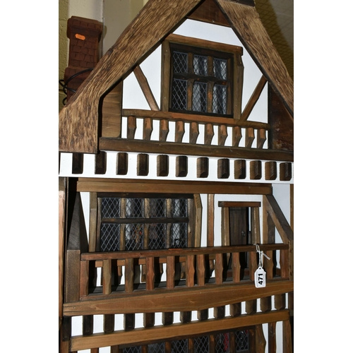 471 - A FOUR STOREY TUDOR WOODEN DOLLS HOUSE, made by Robert Stubbs, model no. F1, detachable magnetic fro... 