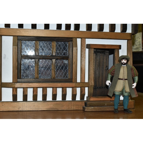 471 - A FOUR STOREY TUDOR WOODEN DOLLS HOUSE, made by Robert Stubbs, model no. F1, detachable magnetic fro... 