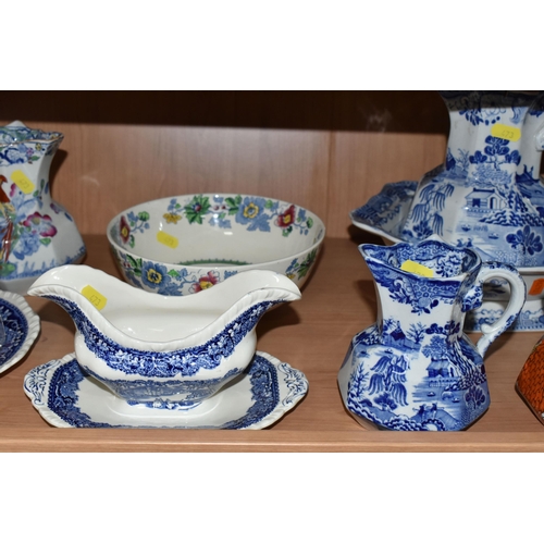 473 - A GROUP OF MASON'S IRONSTONE JUGS, comprising a blue and white 'Willow' pattern pitcher (cracked), a... 