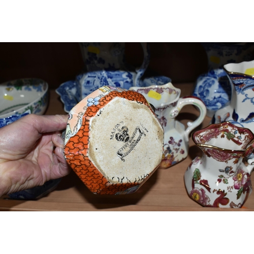 473 - A GROUP OF MASON'S IRONSTONE JUGS, comprising a blue and white 'Willow' pattern pitcher (cracked), a... 